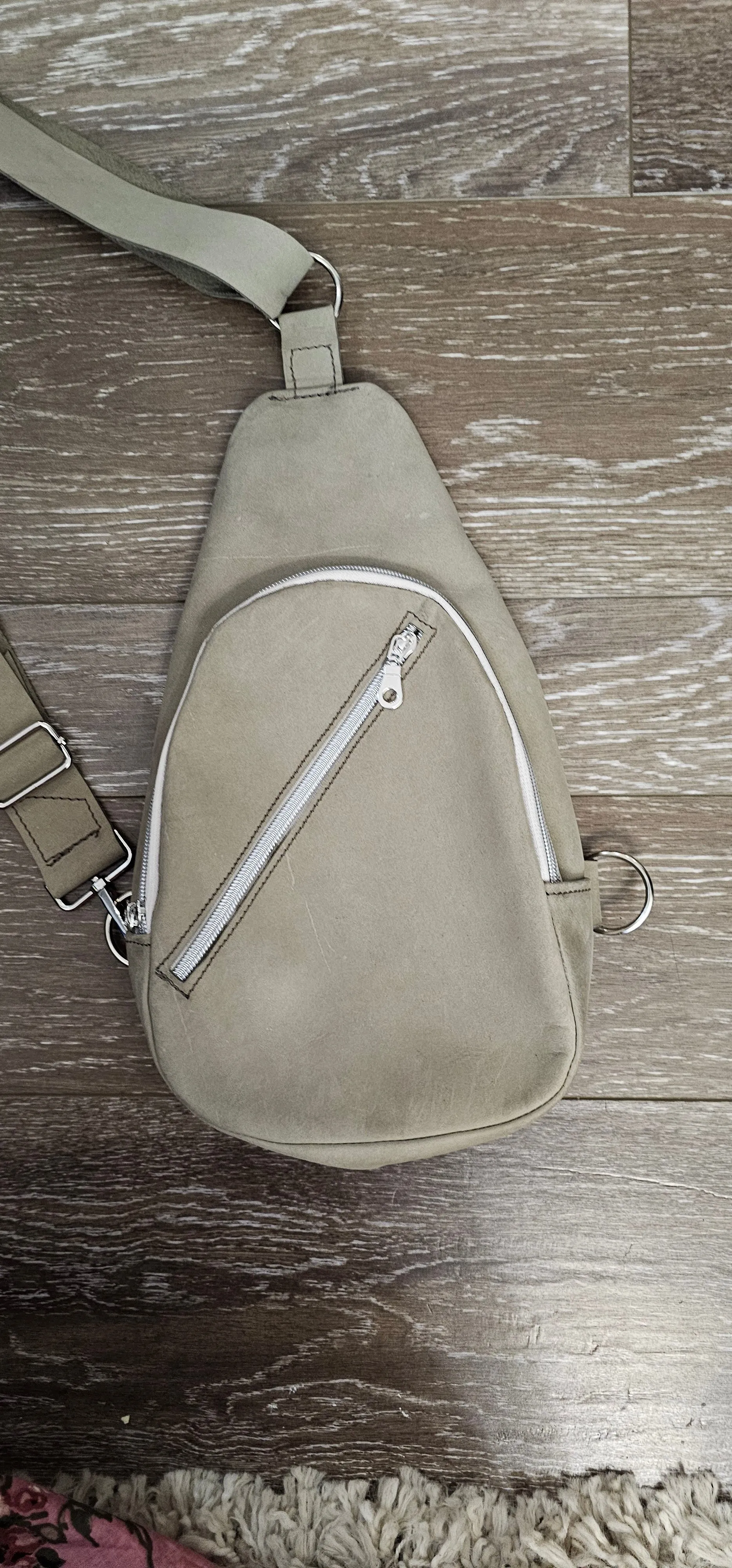 ** sale ** leather sling Moss colored.            slanted front zipper