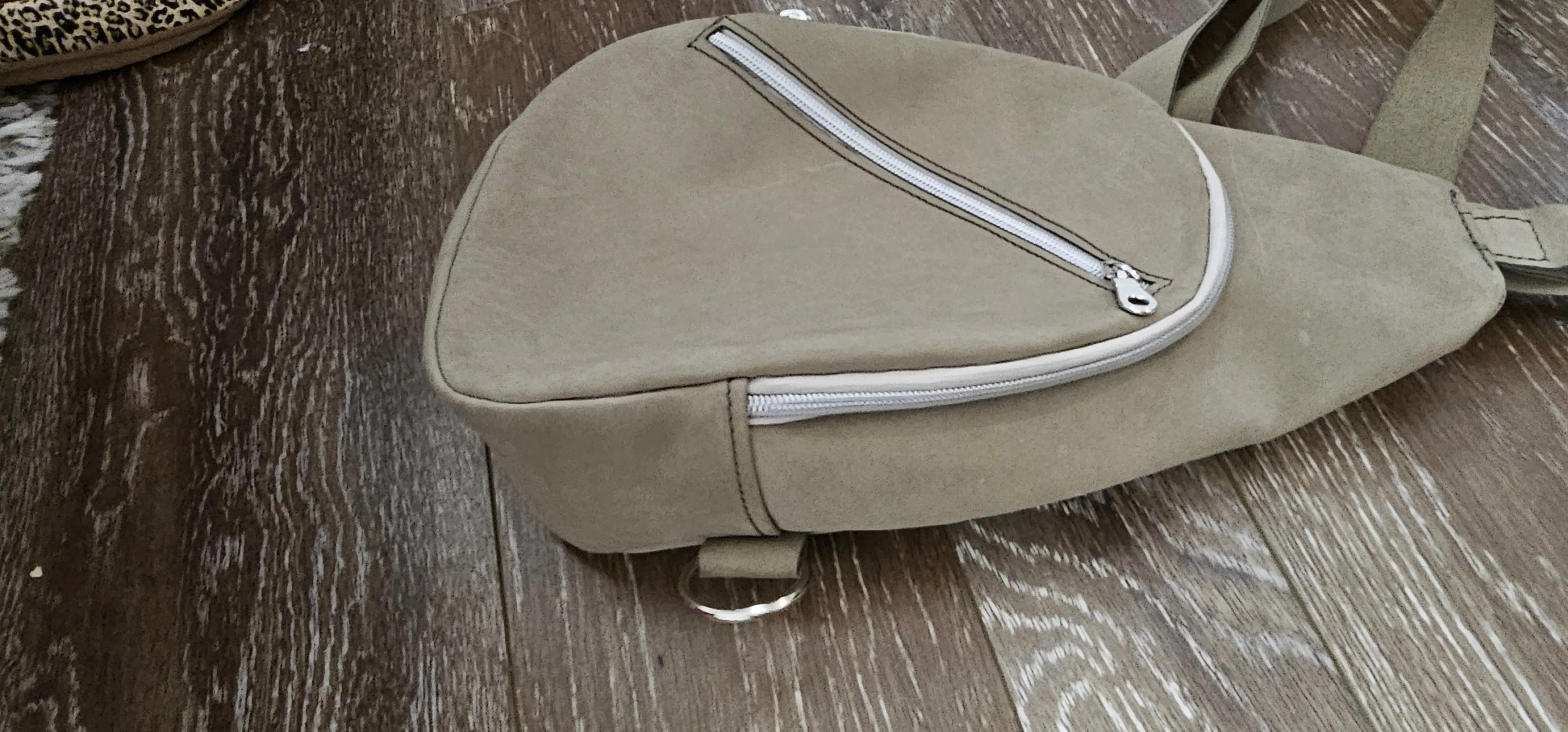 ** sale ** leather sling Moss colored.            slanted front zipper