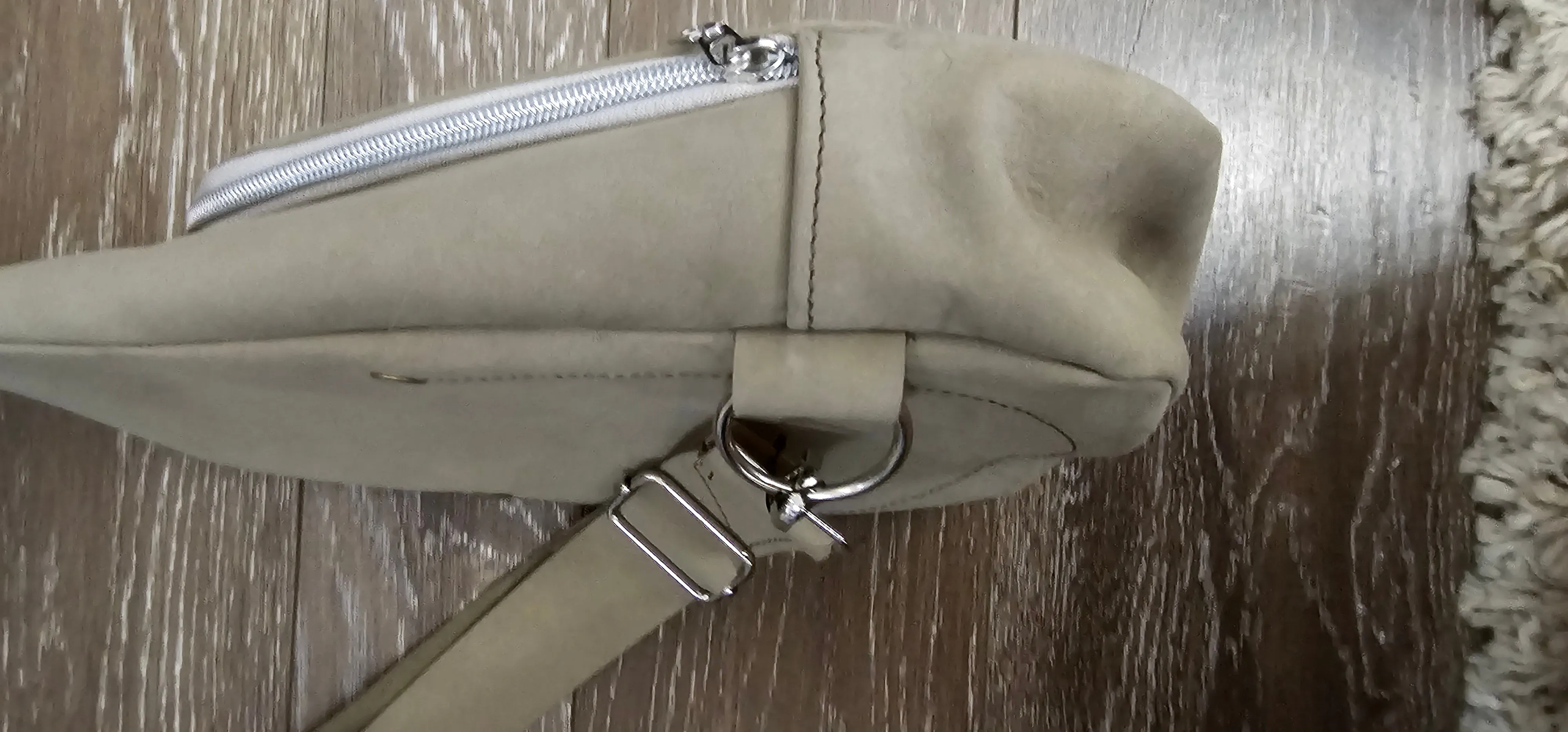 ** sale ** leather sling Moss colored.            slanted front zipper