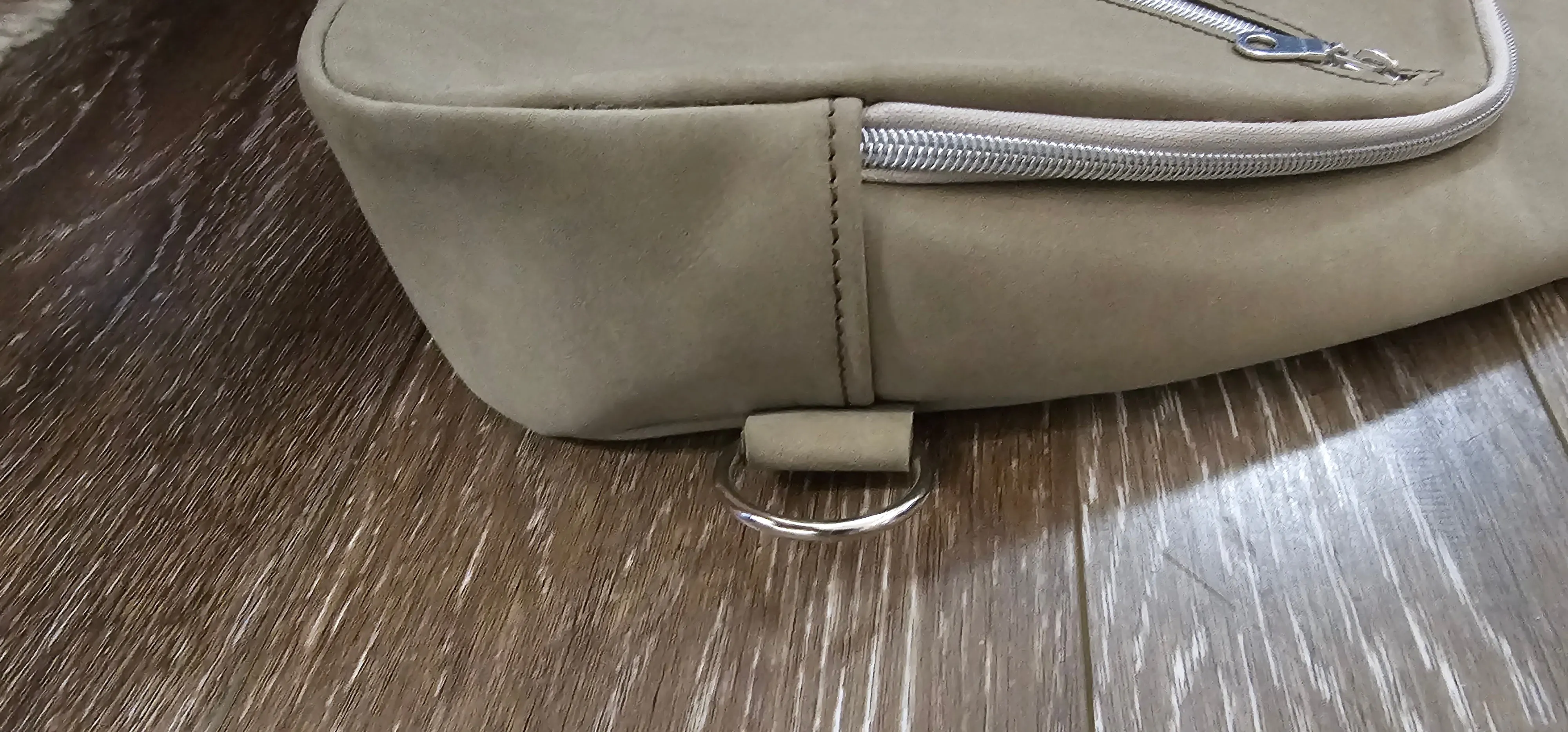 ** sale ** leather sling Moss colored.            slanted front zipper