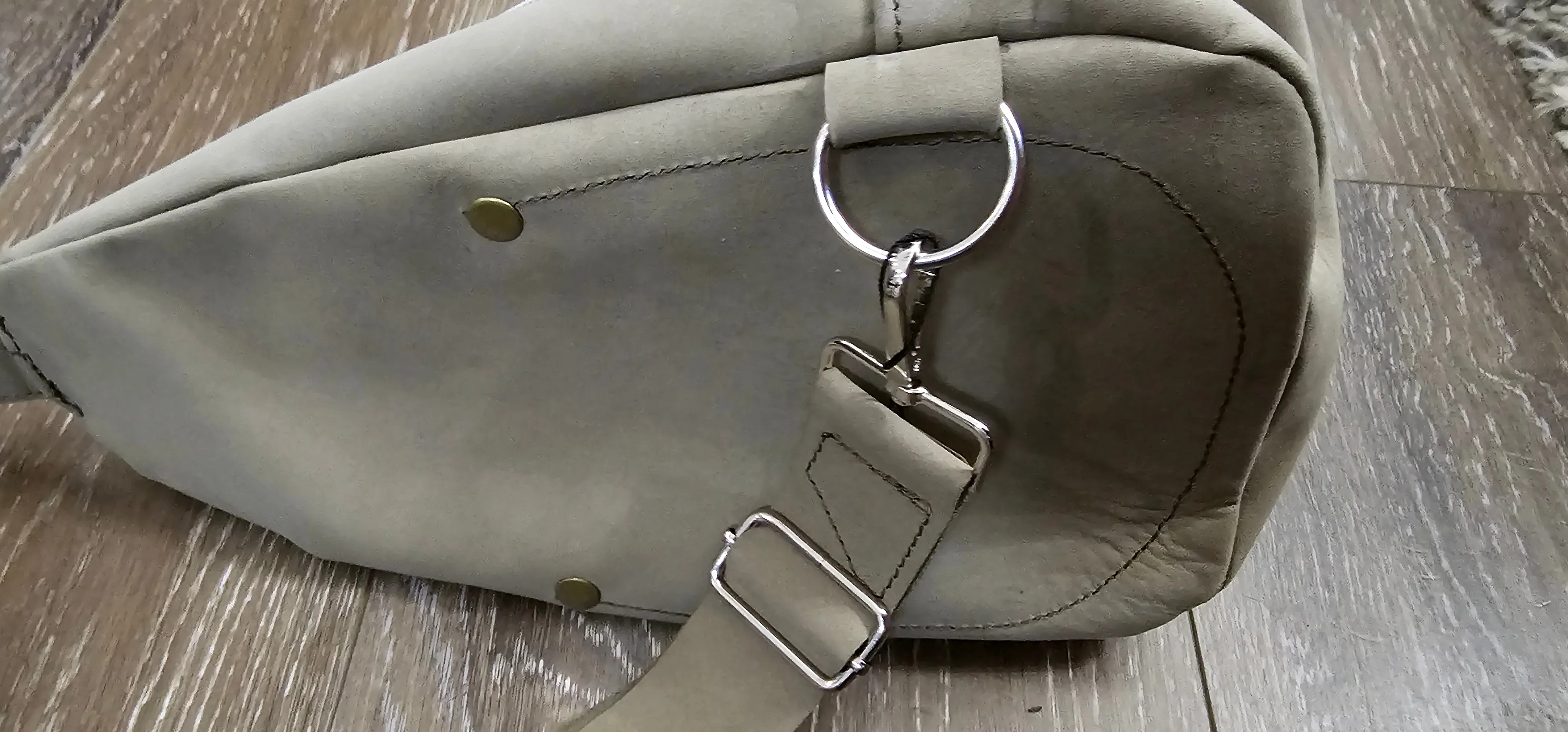 ** sale ** leather sling Moss colored.            slanted front zipper
