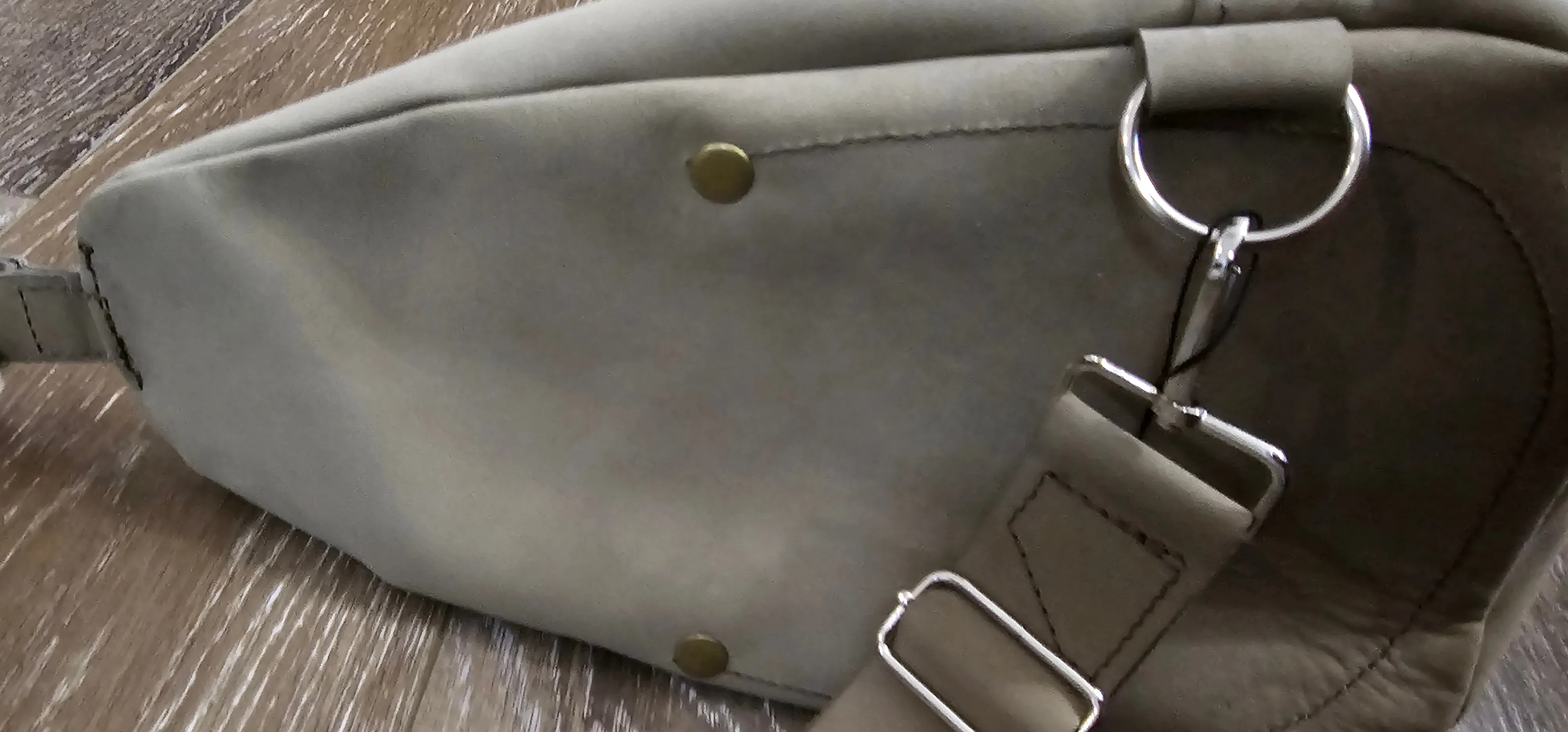 ** sale ** leather sling Moss colored.            slanted front zipper