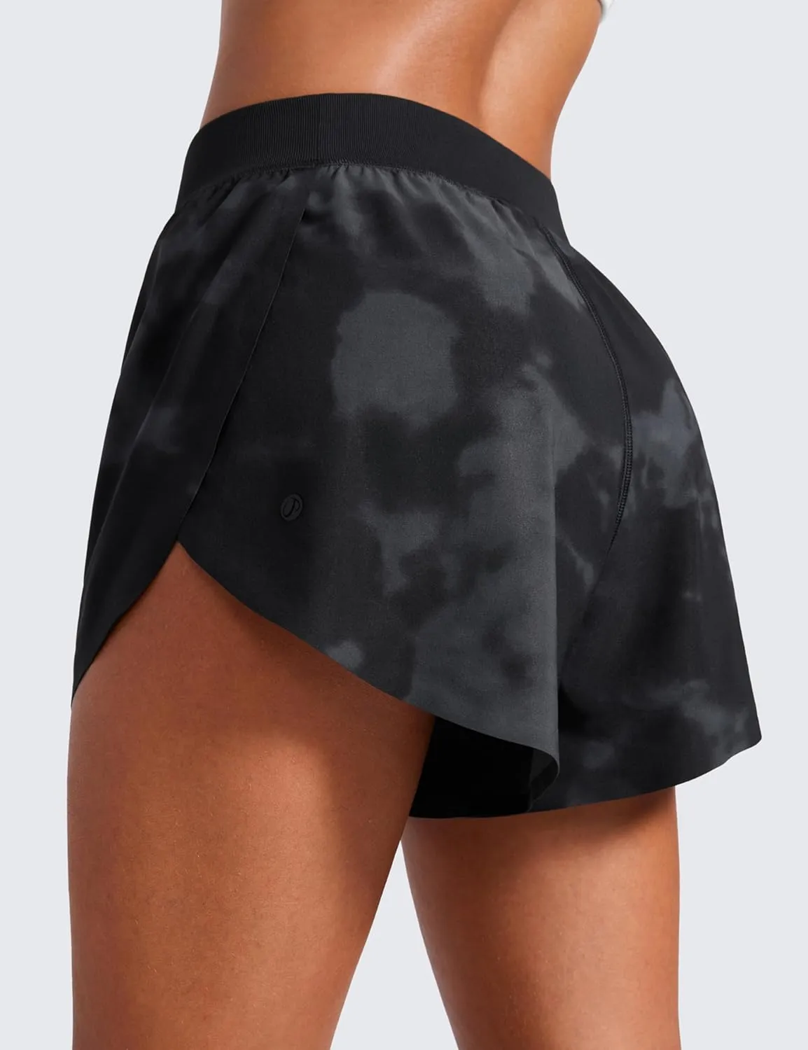 CRZ YOGA Mid Waisted Dolphin Athletic Shorts for Women 4" Lightweight High Split for Gym Workout with Liner Quick Dry