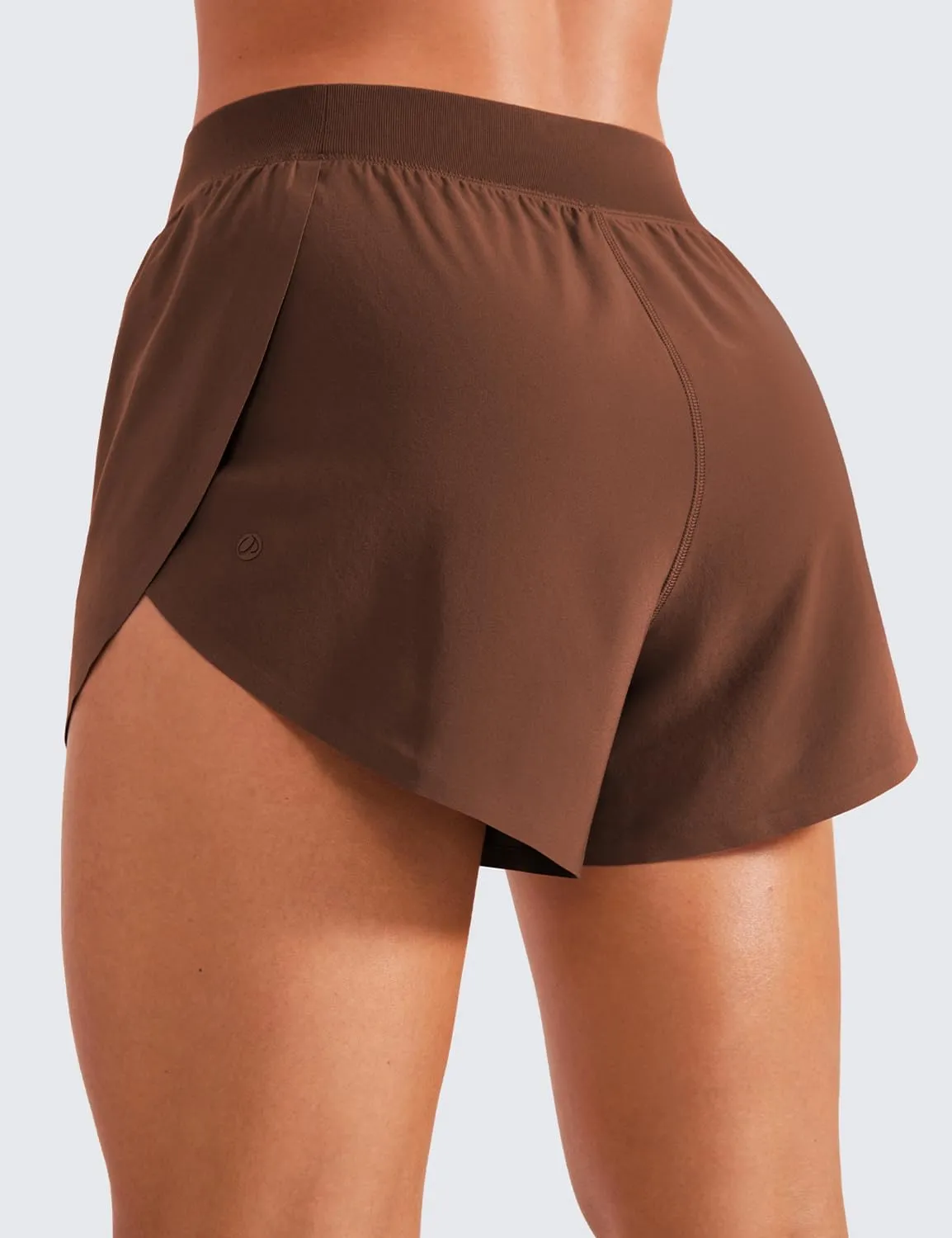 CRZ YOGA Mid Waisted Dolphin Athletic Shorts for Women 4" Lightweight High Split for Gym Workout with Liner Quick Dry
