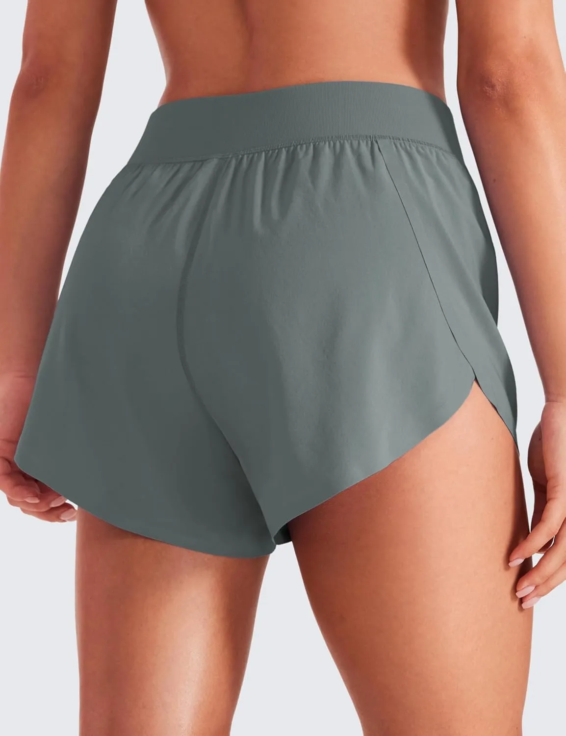 CRZ YOGA Mid Waisted Dolphin Athletic Shorts for Women 4" Lightweight High Split for Gym Workout with Liner Quick Dry