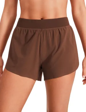 CRZ YOGA Mid Waisted Dolphin Athletic Shorts for Women 4" Lightweight High Split for Gym Workout with Liner Quick Dry
